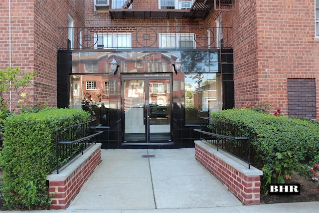 property entrance with brick siding