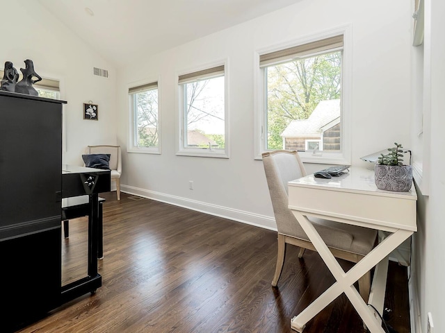home office featuring vaulted ceiling, dark wood finished floors, and baseboards