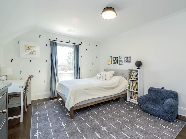 bedroom featuring wood finished floors, baseboards, and lofted ceiling