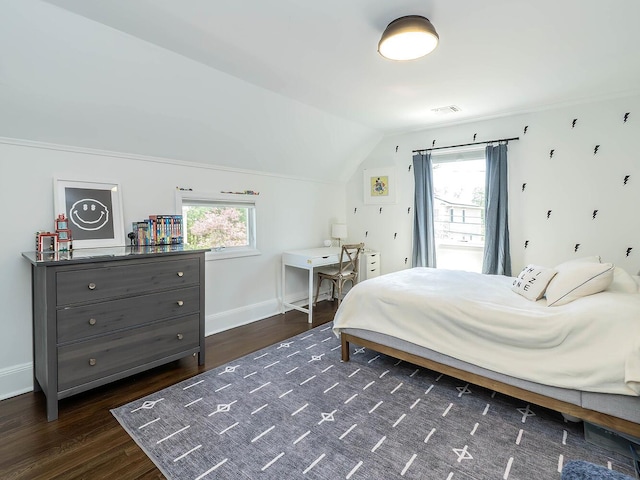 bedroom featuring dark wood finished floors, vaulted ceiling, and baseboards