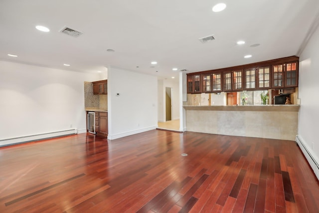 unfurnished living room featuring visible vents, recessed lighting, a baseboard heating unit, and baseboard heating