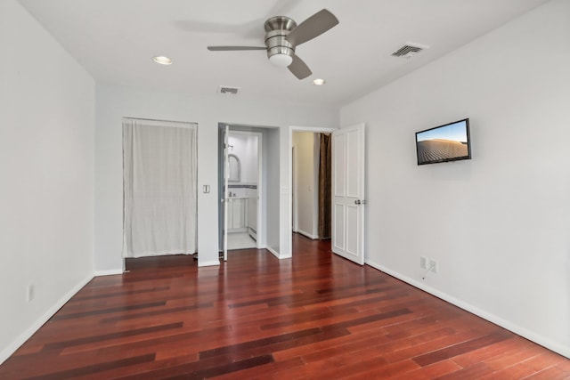 unfurnished bedroom featuring baseboards, recessed lighting, wood finished floors, and visible vents