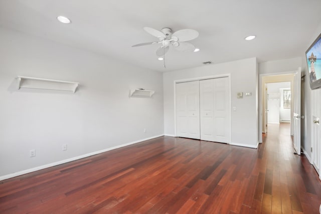 unfurnished bedroom with baseboards, recessed lighting, and wood finished floors