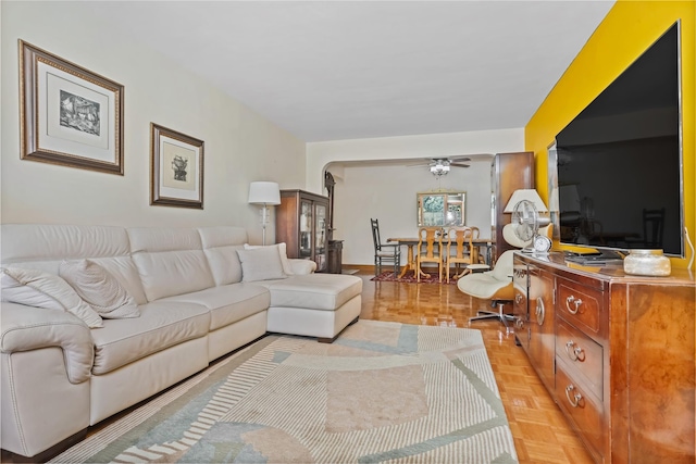 living room featuring a ceiling fan