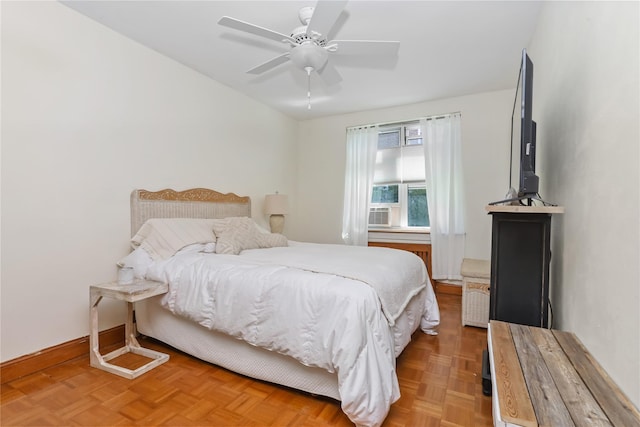 bedroom featuring baseboards and a ceiling fan