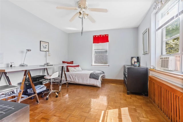bedroom with a ceiling fan and cooling unit
