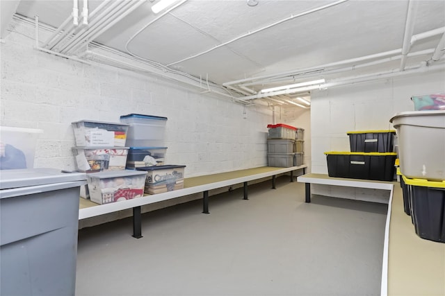 interior space with concrete block wall