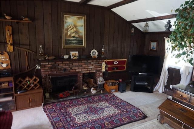carpeted living area featuring wood walls, vaulted ceiling, and a fireplace