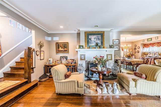 14-35 161st St, Beechhurst, NY 11357 - living area with crown molding, stairway, a chandelier, recessed lighting, and wood finished floors