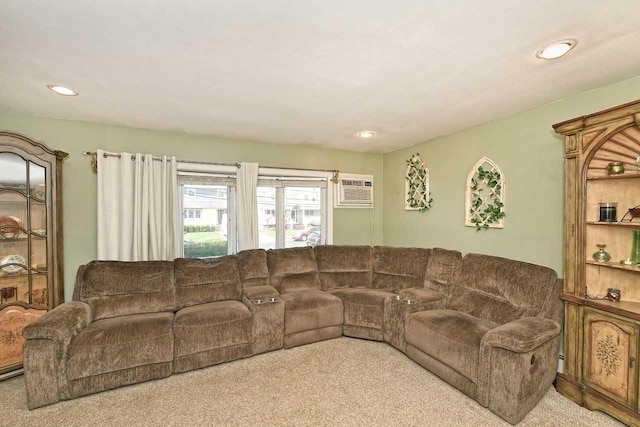 carpeted living area featuring a wall unit AC and recessed lighting