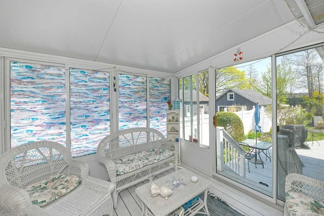 sunroom / solarium featuring a wooden deck