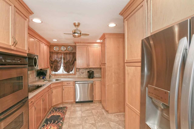 kitchen with light countertops, light brown cabinetry, and stainless steel appliances