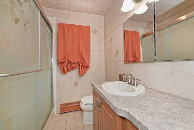 bathroom with tile patterned floors, a shower stall, a baseboard heating unit, and toilet