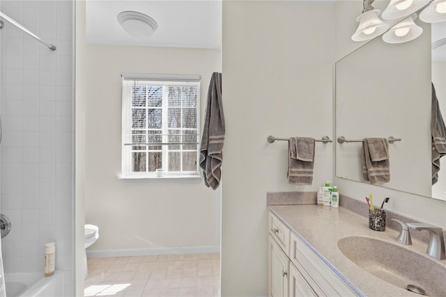full bathroom featuring vanity, baseboards, tile patterned floors, toilet, and  shower combination