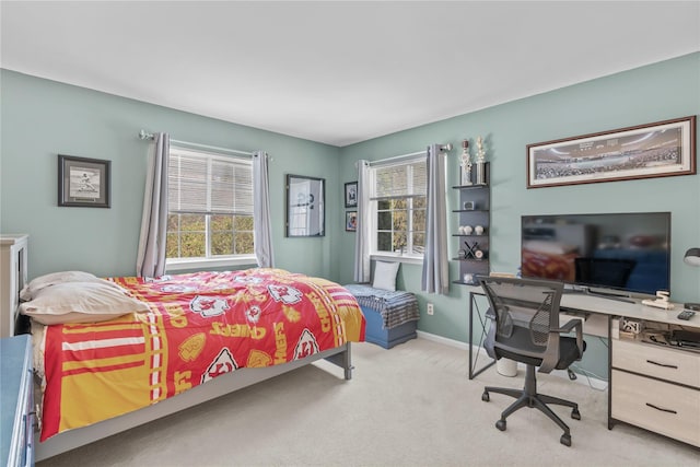 carpeted bedroom with baseboards