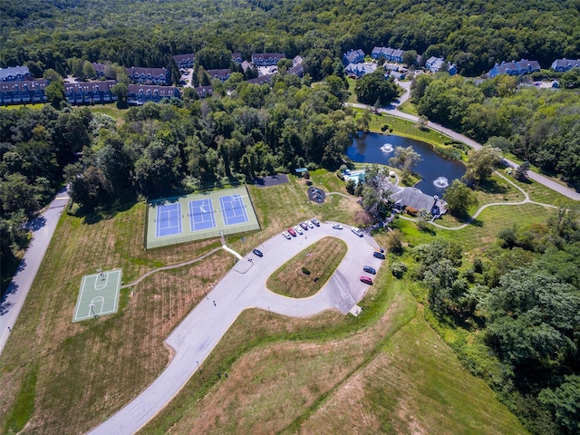 bird's eye view with a view of trees and a water view