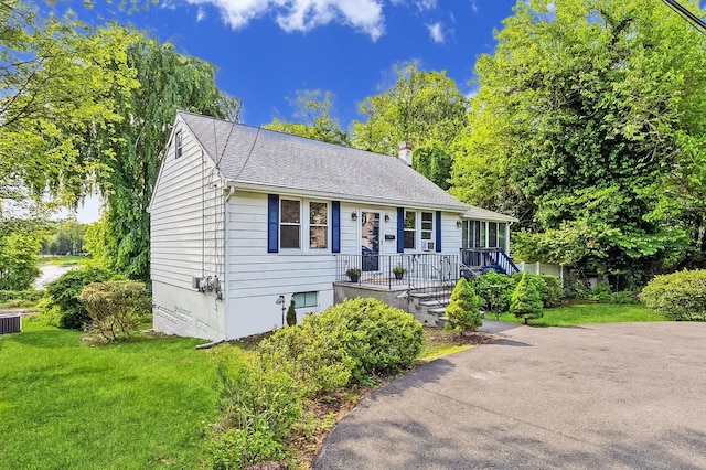 159 S Harrison Ave, Congers, NY 10920 - view of front of home featuring a front lawn and a shingled roof