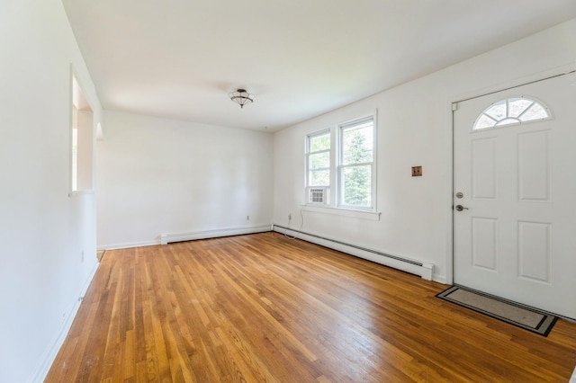 159 S Harrison Ave, Congers, NY 10920 - entrance foyer featuring light wood-type flooring, a baseboard heating unit, baseboards, and baseboard heating