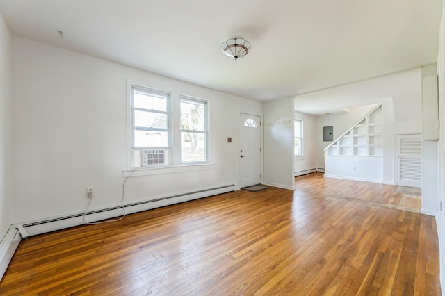159 S Harrison Ave, Congers, NY 10920 - foyer entrance with light wood finished floors, a baseboard radiator, stairway, and baseboards