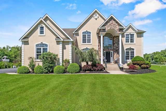 3 Kings Dr, Middletown, NY 10941 - traditional home with a front lawn, stone siding, and stucco siding