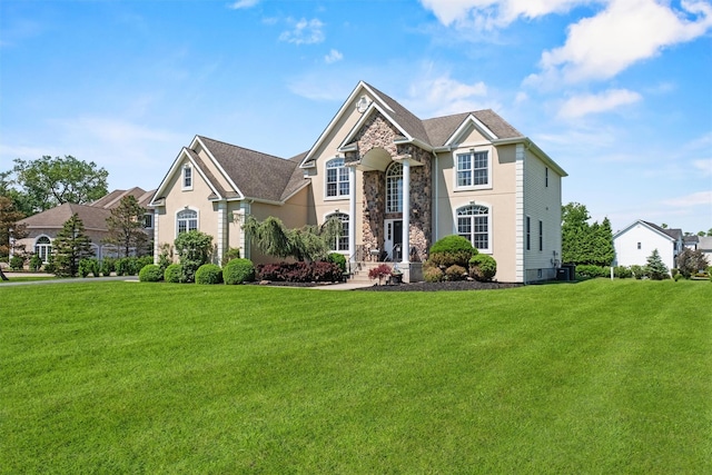 3 Kings Dr, Middletown, NY 10941 - traditional-style house featuring a front lawn, stone siding, and stucco siding