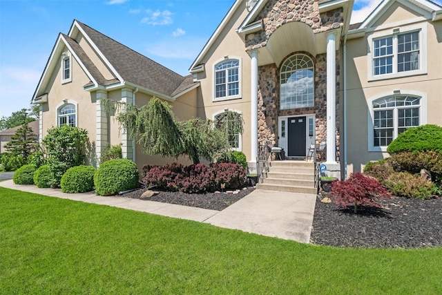 3 Kings Dr, Middletown, NY 10941 - view of front of property with stone siding, a front yard, and stucco siding