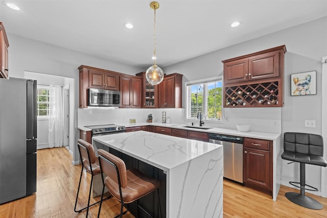 3 Kings Dr, Middletown, NY 10941 - kitchen featuring appliances with stainless steel finishes, a sink, a kitchen island, light wood-style flooring, and recessed lighting