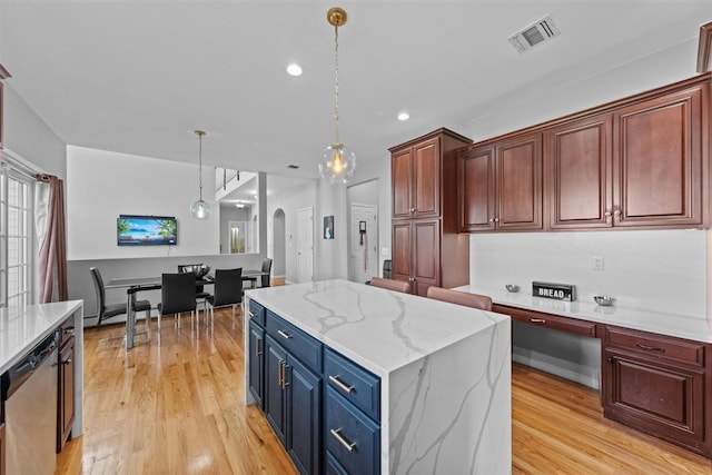 3 Kings Dr, Middletown, NY 10941 - kitchen featuring stainless steel dishwasher, light wood-style flooring, a kitchen island, pendant lighting, and arched walkways