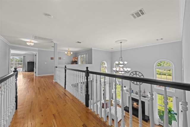 3 Kings Dr, Middletown, NY 10941 - hallway featuring a chandelier, light wood-type flooring, ornamental molding, an upstairs landing, and baseboards