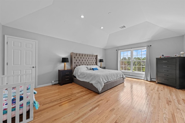 3 Kings Dr, Middletown, NY 10941 - bedroom featuring baseboard heating, vaulted ceiling, and light wood finished floors