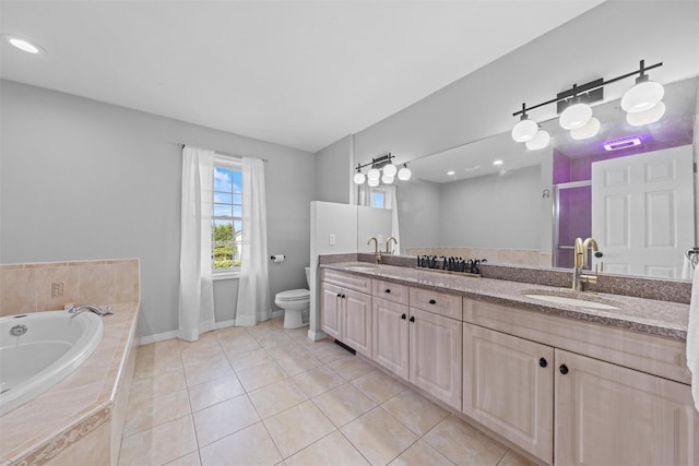 3 Kings Dr, Middletown, NY 10941 - full bathroom featuring toilet, double vanity, tile patterned flooring, a garden tub, and baseboards