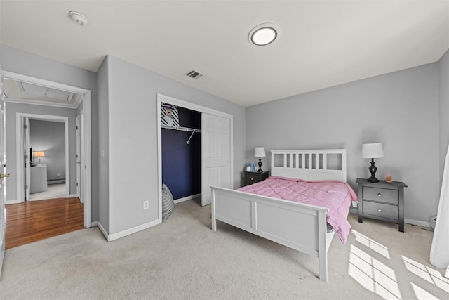3 Kings Dr, Middletown, NY 10941 - bedroom with light colored carpet, baseboards, a closet, and attic access