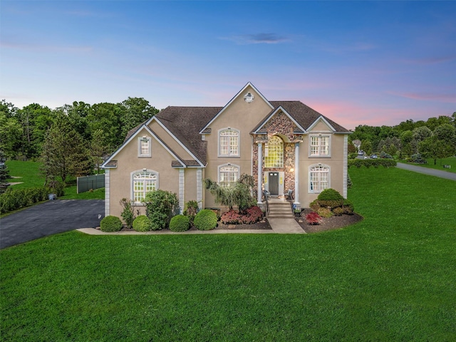 3 Kings Dr, Middletown, NY 10941 - traditional home with stucco siding, a lawn, and stone siding