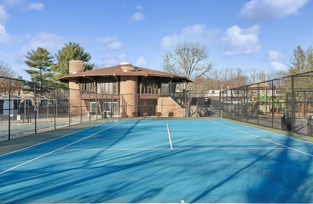 view of sport court with fence