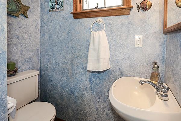 bathroom featuring toilet and a sink
