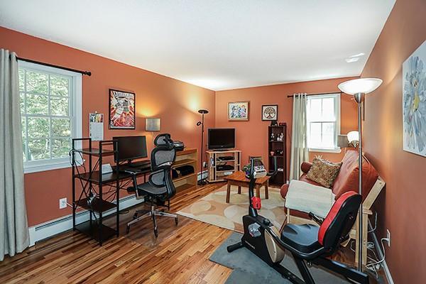 office featuring baseboards and wood finished floors