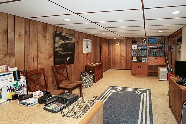 interior space with recessed lighting, light floors, and wooden walls