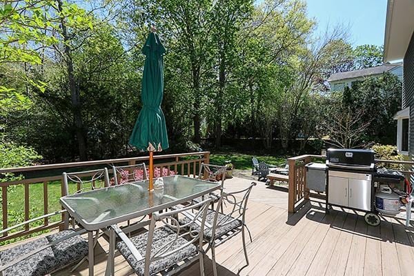 deck with area for grilling and outdoor dining space