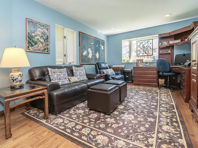 living area with recessed lighting and wood finished floors
