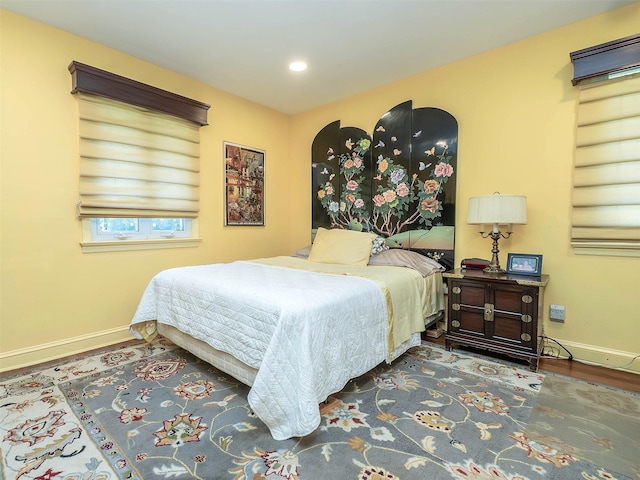bedroom featuring baseboards, recessed lighting, and wood finished floors