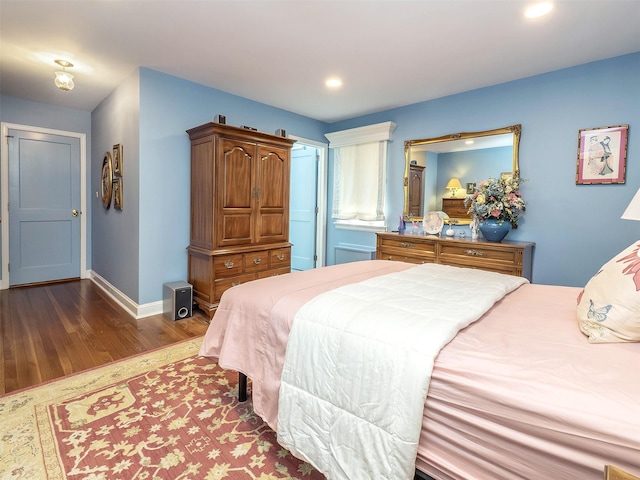 bedroom featuring baseboards, recessed lighting, and wood finished floors