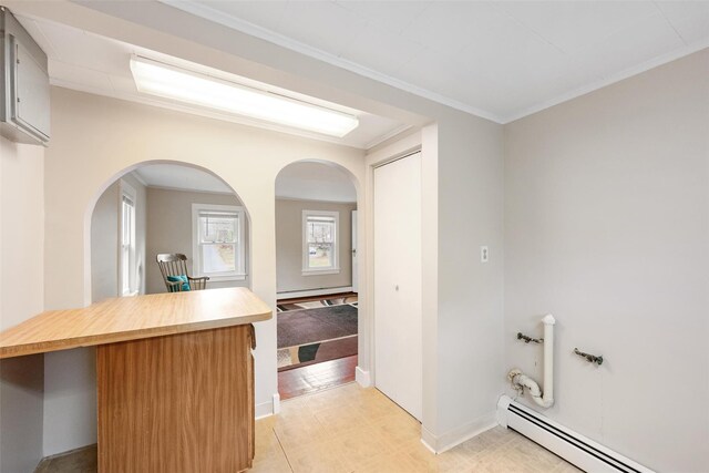 624 Katrina Falls Rd, Rock Hill, NY 12775 - interior space featuring arched walkways, a kitchen breakfast bar, baseboards, and a baseboard heating unit
