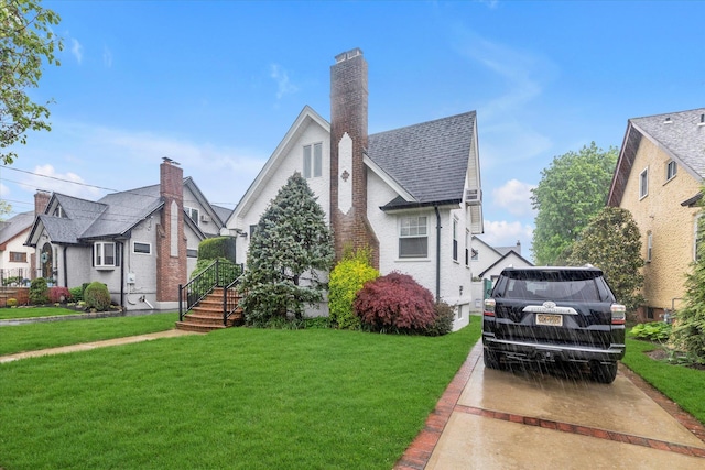 view of front of house with a front lawn and a chimney