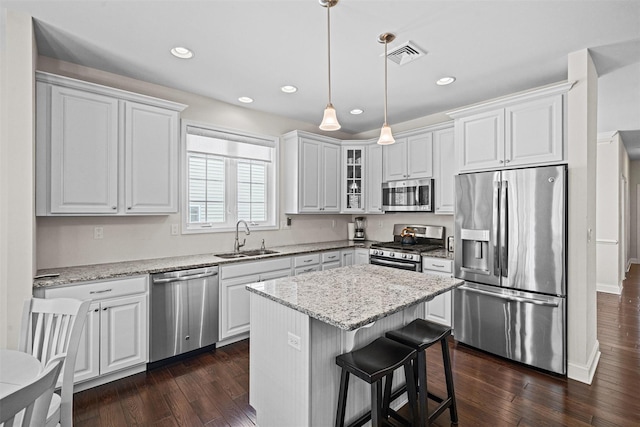 13 Sage Ct, Middletown, NY 10940 - kitchen featuring white cabinets, appliances with stainless steel finishes, a sink, dark wood finished floors, and visible vents