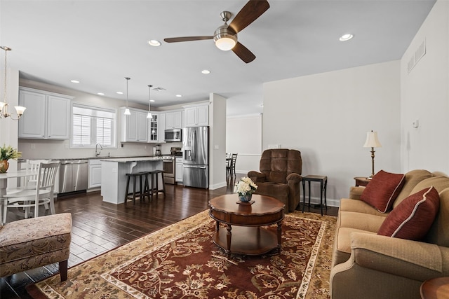 13 Sage Ct, Middletown, NY 10940 - living area with dark wood-type flooring, recessed lighting, ceiling fan with notable chandelier, and visible vents
