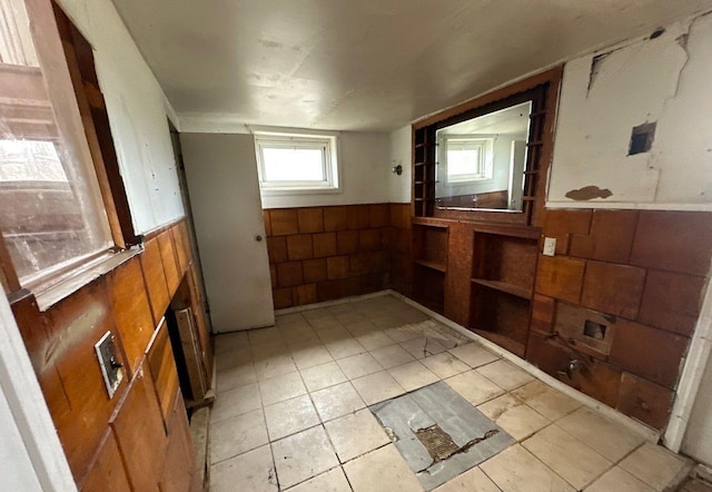 73 4th St, Brentwood, NY 11717 - interior space with wainscoting and wooden walls