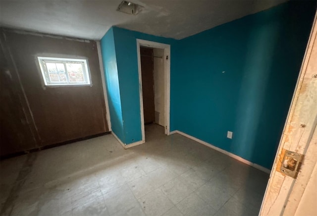 73 4th St, Brentwood, NY 11717 - unfurnished bedroom featuring baseboards