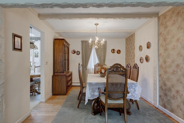 dining space with baseboards, a chandelier, plenty of natural light, and light wood-type flooring