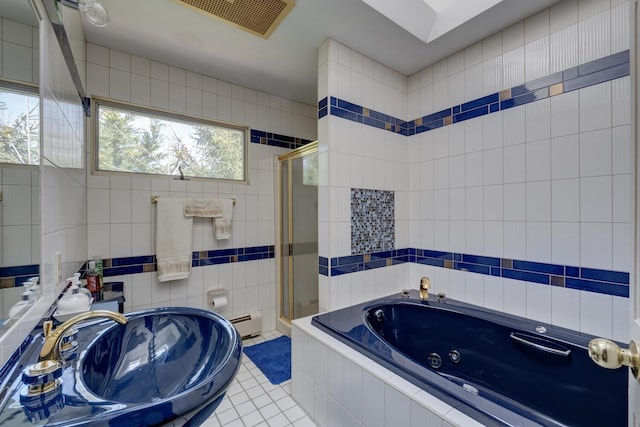 full bathroom with a whirlpool tub, tile walls, a shower stall, and baseboard heating