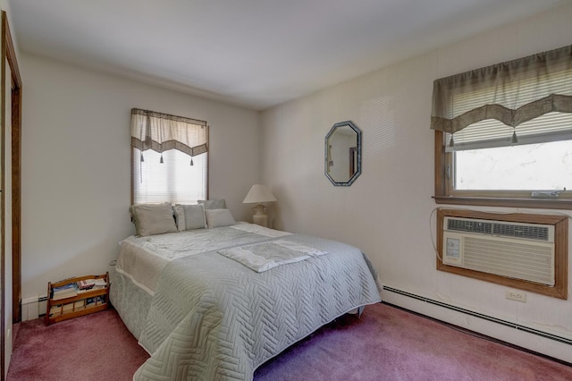 bedroom with carpet, multiple windows, and baseboard heating